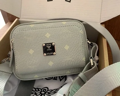 Grey shoulder bag with an adjustable strap